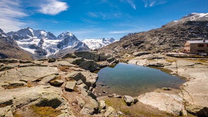 Fuorcla Surlej is a mountain pass in the Swiss Alp (connecting the Upper Engadine Valley with Roseg Valley) with stunning views on the Bernina Massif. There is also a small lake and a mountain hut.