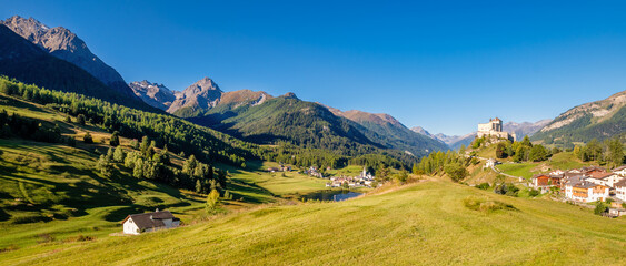 Mountains surrounding the village and castle of Tarasp (Grisons, Switzerland). It lies in the Lower Engadine Valley along the Inn River near Scuol. Tarasp Castle was built in the 11th century.