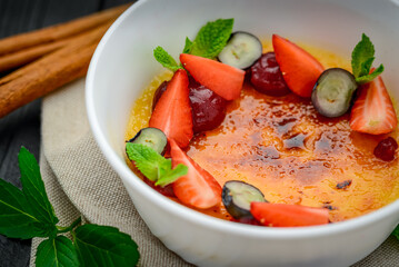 Creme brulee with fruits and berries