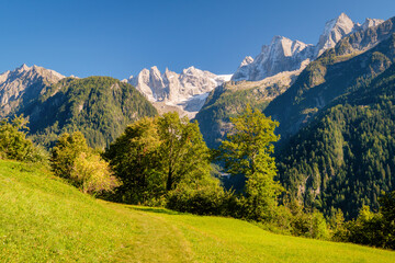On the mountainside on the northern side of Val Bregaglia (Grisons, Switzerland) where Soglio lies the view on Val Bondasca and its glacier is amazing. The Scoria peaks are Piz Cengalo and Piz Badile.