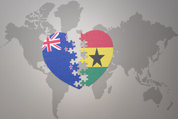 puzzle heart with the national flag of new zealand and ghana on a world map background. Concept.