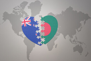 puzzle heart with the national flag of new zealand and bangladesh on a world map background. Concept.