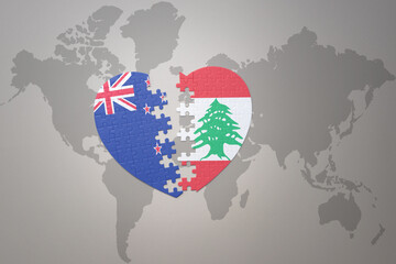 puzzle heart with the national flag of new zealand and lebanon on a world map background. Concept.