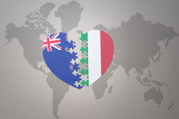 puzzle heart with the national flag of new zealand and italy on a world map background. Concept.