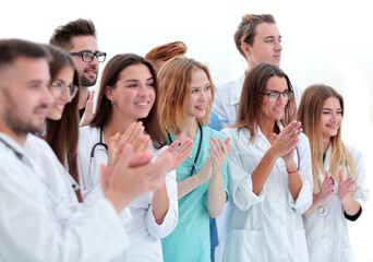 Fototapeta na wymiar close up. a group of different doctors applauds together.
