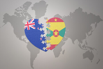 puzzle heart with the national flag of new zealand and grenada on a world map background. Concept.
