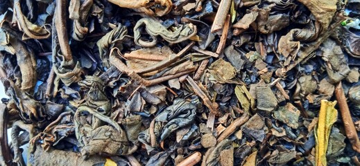 Roasted tea leaf on the white gray background. Camellia sinensis plant. Suitable for promotion of food and beverage industry and company.