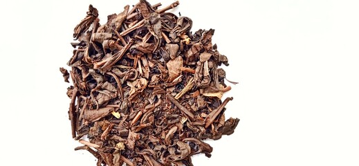 Roasted tea leaf on the white gray background. Camellia sinensis plant. Suitable for promotion of food and beverage industry and company.