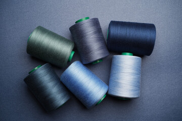 Colorful thread spool background, close-up