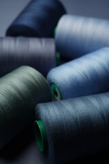 Colorful thread spool background, close-up