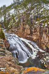 Obraz premium Gorge with stunning waterfall in Yellowstone