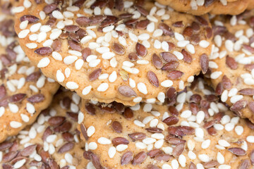 round cookies with sesame seeds and flax