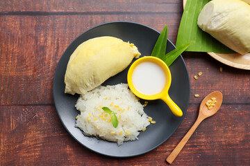 Durian sticky rice topped with mung bean and coconut milk with copy space - Thai dessert , seasonal...