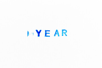 Blue color ink of rubber stamp in word year on white paper background