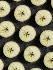 Pattern of apples slice with star on black concrete background. Creative flatlay with summer fruit.