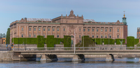 Fototapeta na wymiar The parliament building with the Town City Hall in the background a sunny summer day in Stockholm