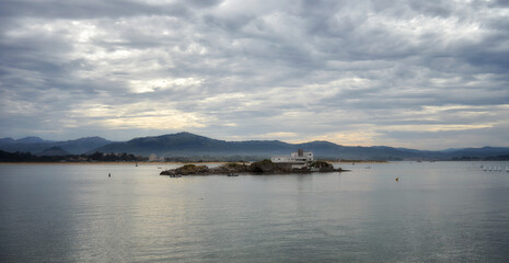 Seascape of the coast of Cantabria with cloudy sky