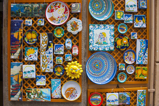 Souvenirs suns from ceramics at showcase in Sorrento