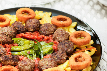 Mixed Roast Plate. meatballs, potatoes, peppers and onion rings