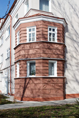 modern plastic windows in the wall of the house