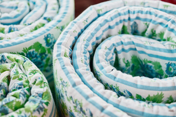 Close-up of a twisted wadded mattress.