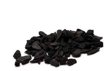 Closeup pile black stones coal white background