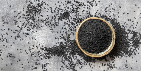 Indian spice Black cumin (nigella sativa or kalonji) seeds in bowl top view