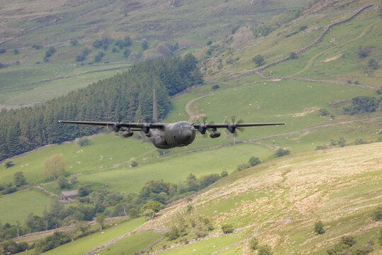 Green cargo plane carrying out low level flying in the United Kingdom.
