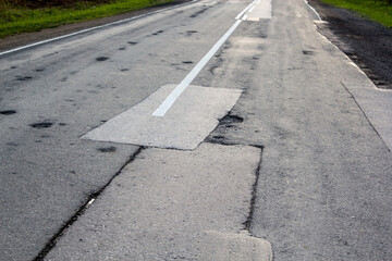 Old repaired asphalt road