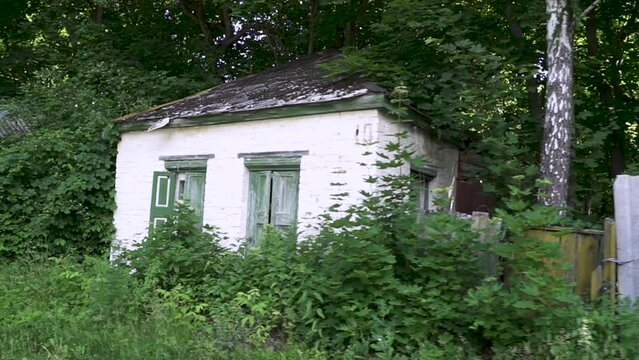 Abandoned residential old house in the thickets of Chernobyl. Chernobyl city. Ukraine