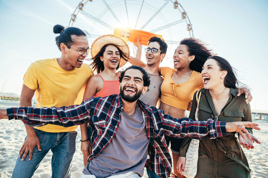 Multiracial group of friends making beach party on summertime vacation - Cheerful young people having fun together hanging outside on a sunny day - Summer holidays and friendship concept