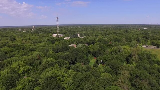 Aerial view of buildings in the dense green wilds of Chernobyl. Chernobyl exclusion zone. Ukraine.