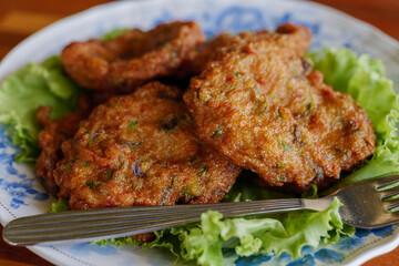Thai Fish cake serve with sweet sauce.