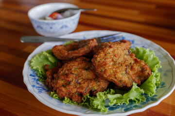 Thai Fish cake serve with sweet sauce.