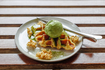 Matcha Green tea ice cream on croissant waffles. 
