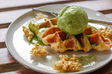 Matcha Green tea ice cream on croissant waffles. 
