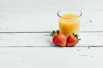 Glass of milk, strawberry and cereal