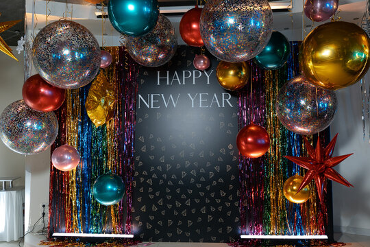 New Year's Eve photo area at the party. Lots of colorful helium balloons.