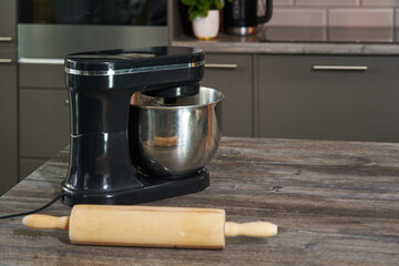 rolling pin and large cooking mixer on the table. cooking. copyspace