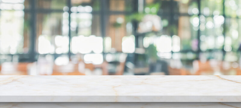 marble table top with blurred kitchen cafe restaurant interior background