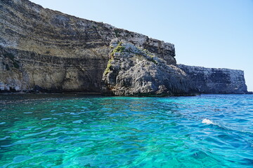 Crystal lagoon and cliffs on european Comino island in Malta