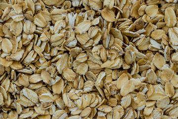 Oat groats. Background texture of oatmeal. Background of oatmeal. Cereals. Texture.
