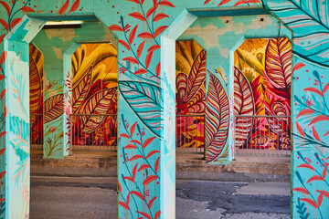 Creative graffiti in tunnel of feathers