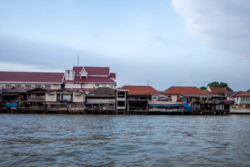 Fototapeta na wymiar Outdoor scenery along riverside of Chao Phraya River in Bangkok, Thailand. 