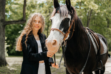 Woman walking with a horse