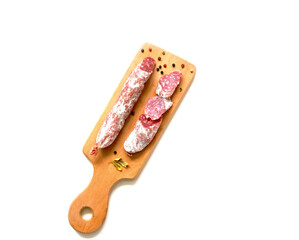 Dry sausage fuet in natural casing whole and sliced on white background. Sin Gluten. Tradicion mediterranea. 