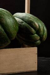 Fresh green traditional latin fruit on black wooden table	