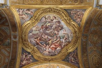 Obraz premium Santi Ambrogio e Carlo al Corso Basilica Ceiling Fresco with Heavenly Scene and Golden Stucco Decoration in Rome, Italy