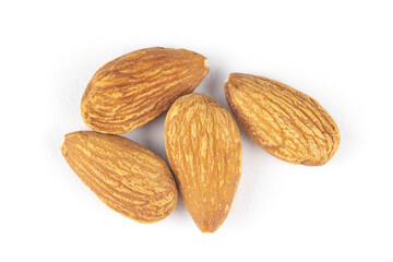Peeled almonds on a white isolated background. A handful (a bunch, four) of nuts in close-up.