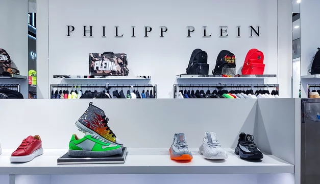 SPAIN, BARCELONA, MARCH, 2022: Modern interior of Philipp Plein boutique with a new collection of sports shoes in shopping mall, Barcelona. Spain